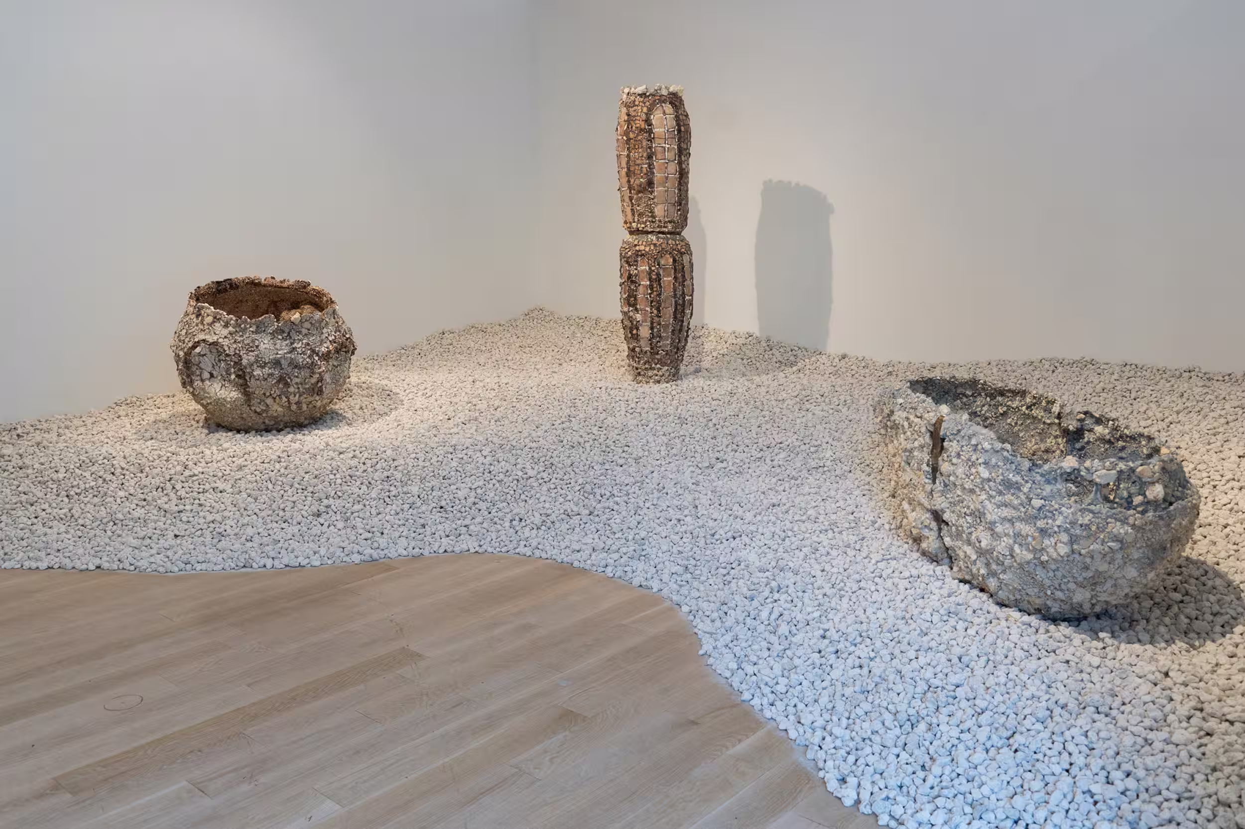Yasunaga installation at ICA Miami — three vessels set in a low landscape of white crushed stone.