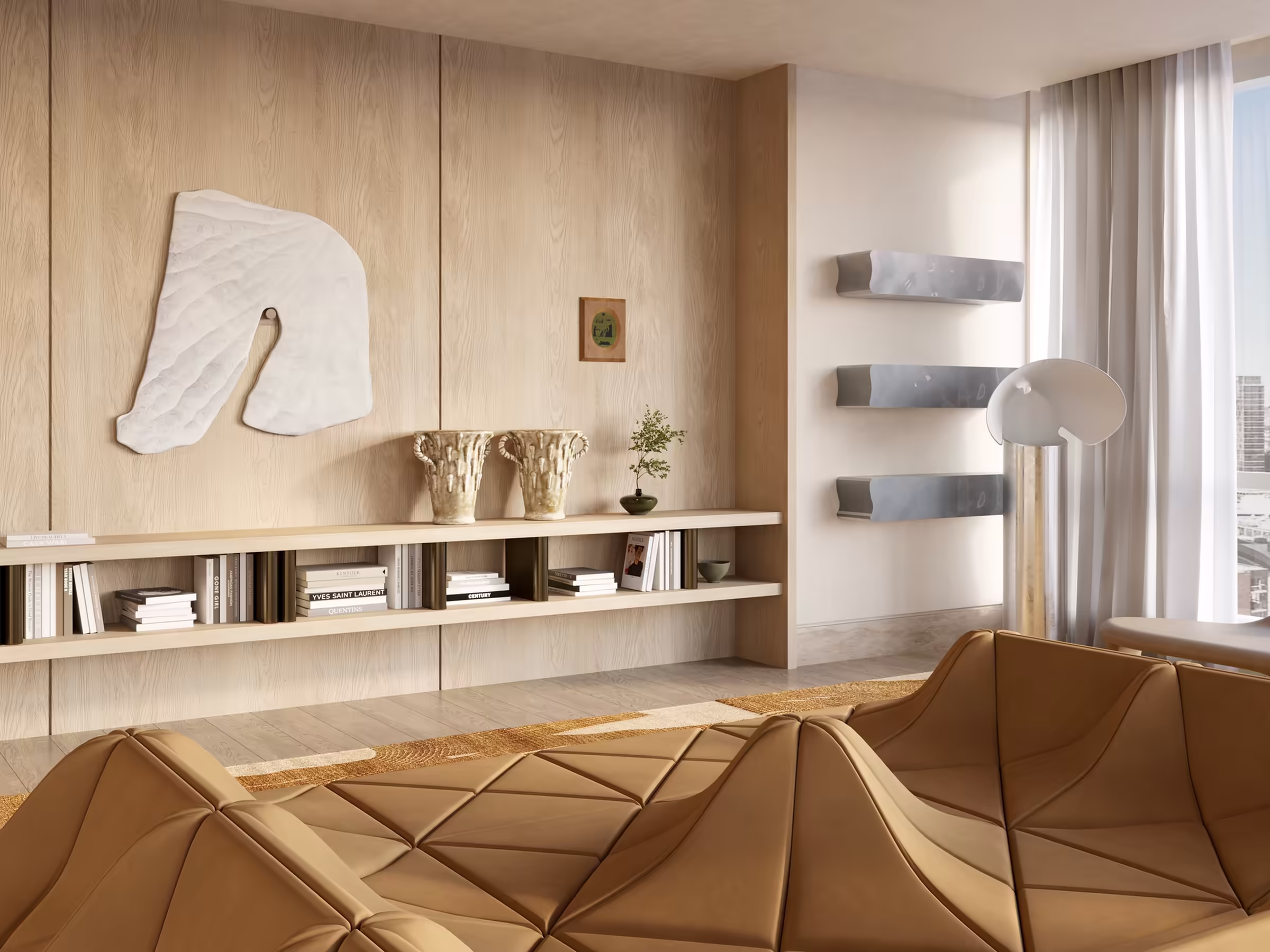 Warm-toned living room with a sculptural brown Dune modular sofa by Pierre Paulin. Custom wood paneling and built-in shelving house curated books and art. Wall-mounted sculptures and natural textures complete the contemporary setting.