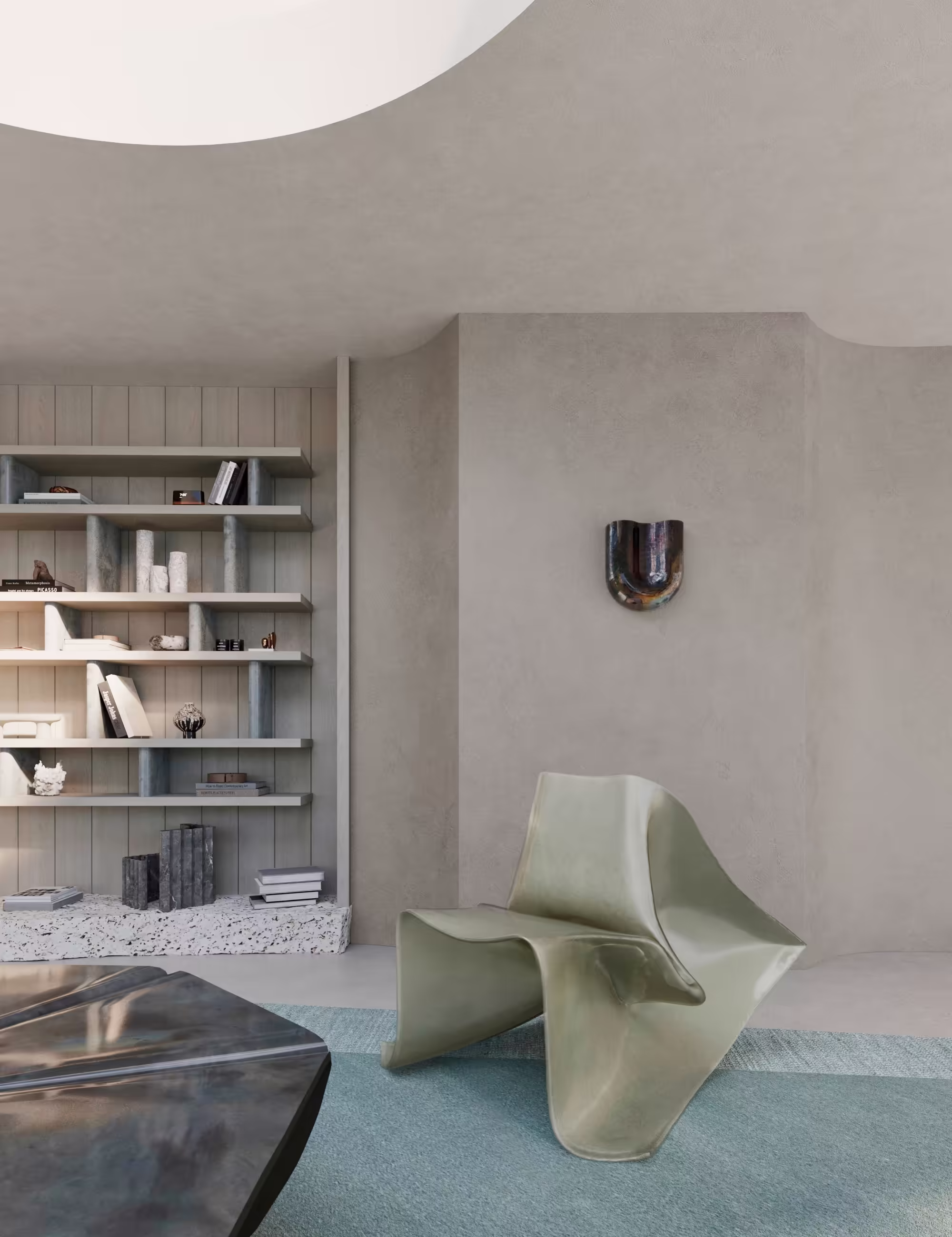 Detail view of the living area showing Fold Chair in raw fiberglass, Onda ceramic sconce, and shelving built into sculpted walls.