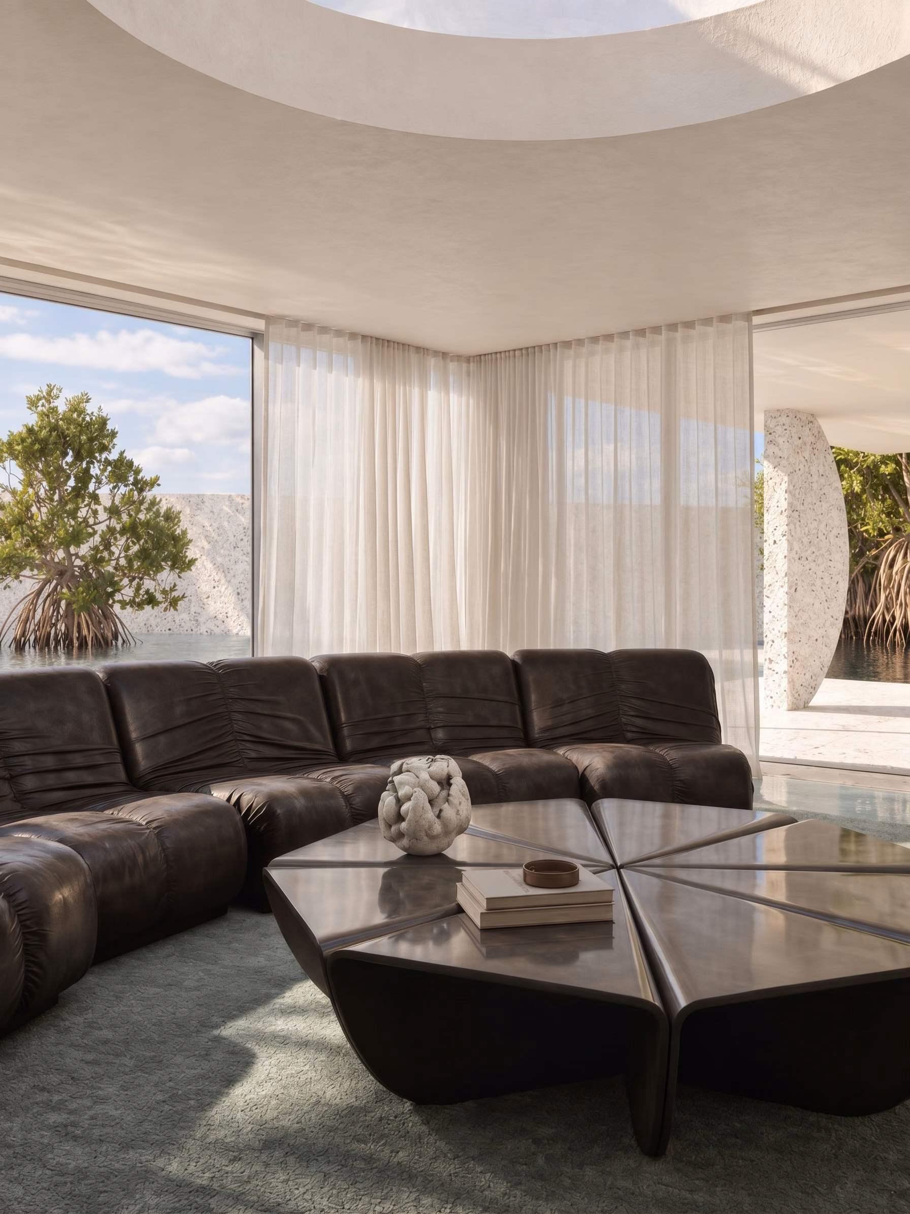 Alternate view of living room highlighting the Fen Sofa and custom ceramic coffee table inspired by seed pod geometry.